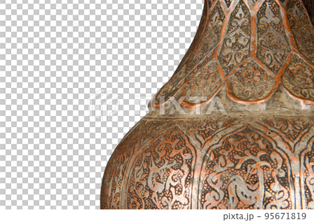 A part of an antique copper jug with artistic chasing and engraving on a white background 95671819