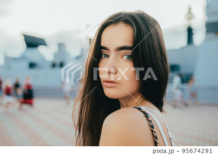 Portrait of brunette girl with blue eyes 95674291