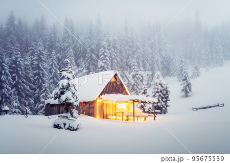 Fantastic landscape with snowy house 95675539