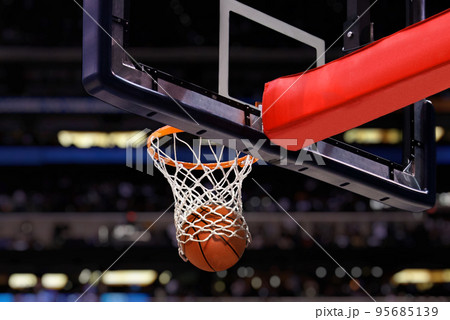 Basketball shot to the hoop in a competitive game at stadium 95685139