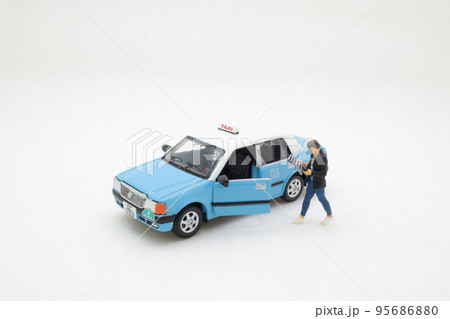 a figure man near cab reading information from daily press 95686880