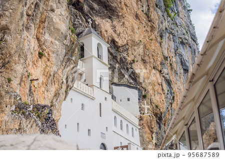 Monastery of Ostrog, Serbian Orthodox Church situated against a vertical background, high up in the large rock of Ostroska Greda, Montenegro. Dedicated to Saint Basil of Ostrog Monastery of Ostrog, Serbian Orthodox Church situated against a vertical background, high up in the large rock of Ostroska Greda, Montenegro. Dedicated to Saint Basil of Ostrog 95687589