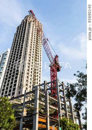 View of the building construction site with cranes in Taichung, Taiwan. 95690140