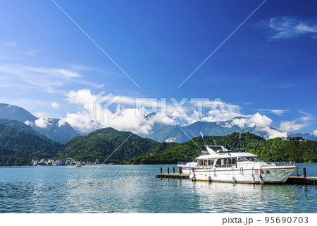 The scenery of the Yacht Marina at Sun Moon Lake in the morning is a famous attraction in Nantou, Taiwan. The scenery of the Yacht Marina at Sun Moon Lake in the morning is a famous attraction in Nantou, Taiwan. 95690703