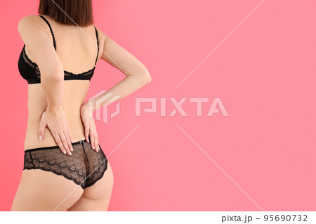Attractive girl in underwear on pink background, space for text 95690732