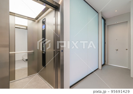 Corridor with passenger lift. Interior of modern residential building. 95691429