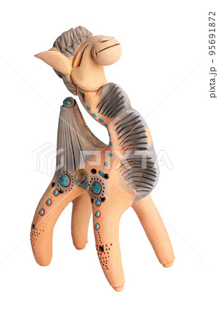 A camel, clay oriental souvenir on a white background 95691872