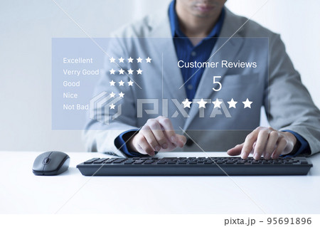 Satisfaction and customer service survey concept, business people using  laptop. to answer the questionnaire And the satisfaction rating, the satisfaction rating with the icon 5 stars. 95691896