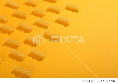 Flat lay with fusilli pasta, space for text Flat lay with fusilli pasta, space for text 95692446