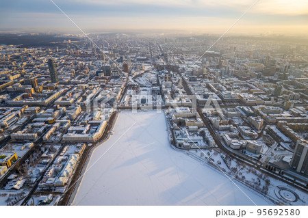 Embankment of the central pond and Plotinka in Yekaterinburg at winter sunset. The historic center of the city of Yekaterinburg, Russia, Aerial View 95692580