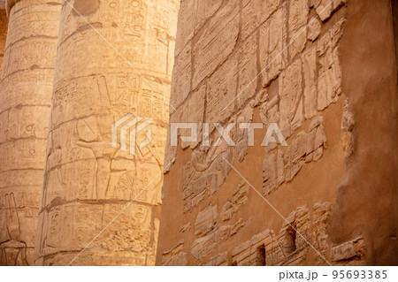 Different hieroglyphs on the walls and columns in the Karnak temple. Karnak temple is the largest complex in ancient Egypt. 95693385