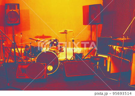 Live music photo background, rock drum set with and blurred stage lights. Thermography gradients, retro glitch, noise, selective focus 95693514