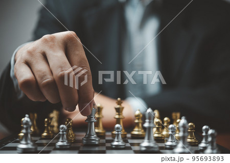 Strategic planning and goals success business idea. Businessman looking at chess at the board. Strategic planning and goals success business idea. Businessman looking at chess at the board. 95693893