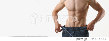 Fit man with muscles, show how big pants, slim body, perfect figure Fit man with muscles, show how big pants, slim body, perfect figure 95694375