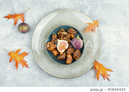 Dried and fresh figs, top view 95694495