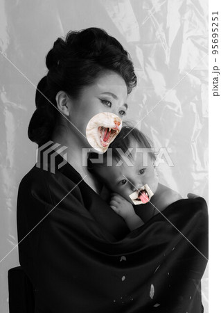 Contemporary art collage. Creative design. Beautiful young woman, geisha with baby. Cat's muzzle elements 95695251