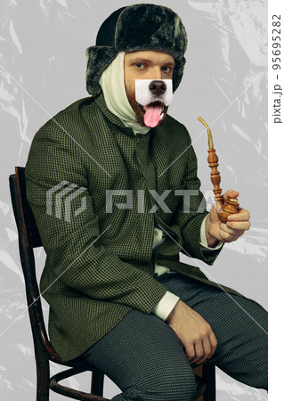 Contemporary art collage. Portrait of bearded man playing famous artist Van Gogh with dog's mouth isolated on grey background Contemporary art collage. Portrait of bearded man playing famous artist Van Gogh with dog's mouth isolated on grey background 95695282