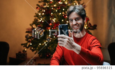 Boy is making a Christmas Video Call 95696315