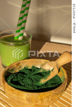 Blue-green algae Chlorella and spirulina powder. Super powder. Natural supplement of algae. Detox superfood drink cocktail. Food supplement source of protein and beta carotene 95697516