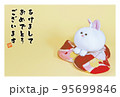 お手玉に乗ったうさぎのぬいぐるみの和風年賀状 95699846
