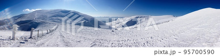 Sun over winter mountains, covered with snow 95700590