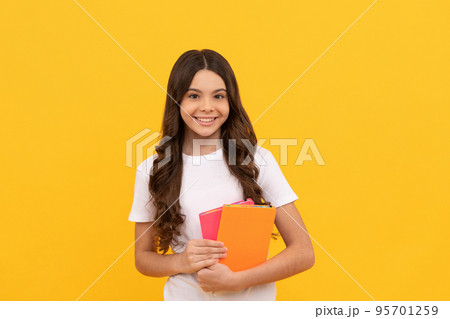 smiling school child ready to study with workbook, school smiling school child ready to study with workbook, school 95701259