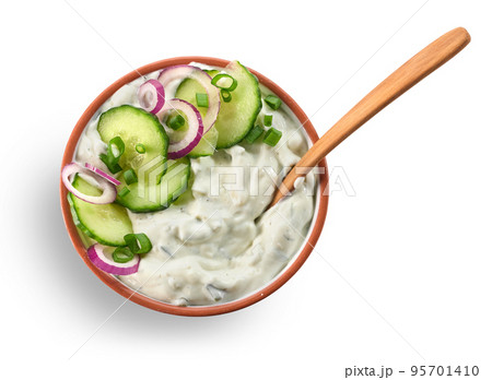 bowl of greek yogurt with cucumber and red onion bowl of greek yogurt with cucumber and red onion 95701410