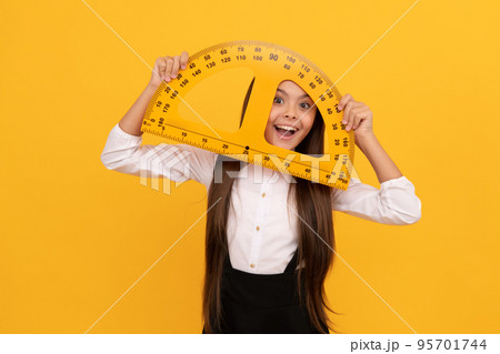 education for child. mathematics. cheerful teen girl hold protractor ruler. back to school 95701744