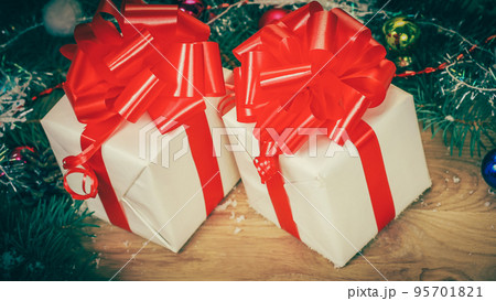 closeup.Christmas gifts and Christmas wreath on wooden backgrou closeup.Christmas gifts and Christmas wreath on wooden backgrou 95701821