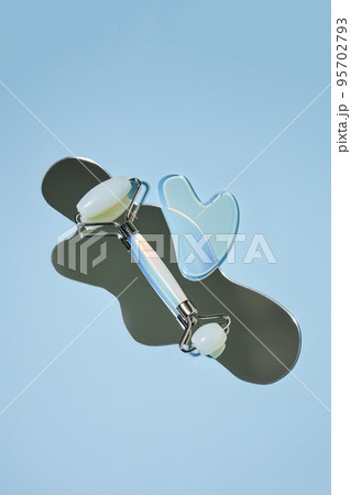 Blue jade face roller and Gua Sha scraping for beauty facial massage therapy Blue jade face roller and Gua Sha scraping for beauty facial massage therapy 95702793