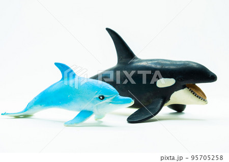 Dolphins and Orcs Toys on white background 95705258