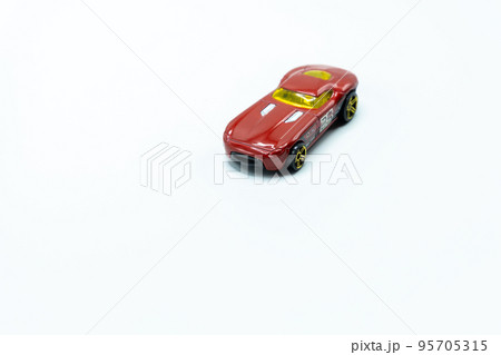 Red race car toy with yellow windshield 95705315