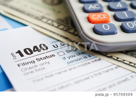 Tax form 1040 U.S. Individual Income Tax Return, business finance concept. Tax form 1040 U.S. Individual Income Tax Return, business finance concept. 95709309