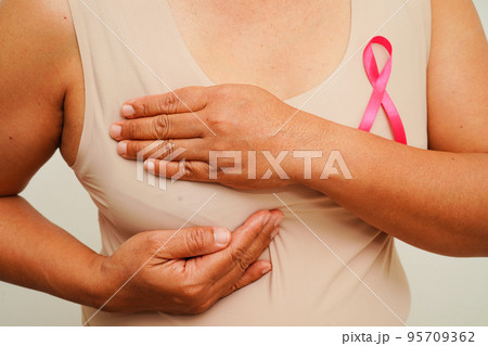 Asian woman with pink ribbon, World Breast Cancer Day at October. Asian woman with pink ribbon, World Breast Cancer Day at October. 95709362