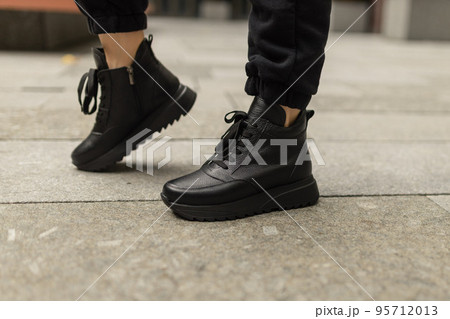 Elegant womens shoes on the foot on the street. Comfort and fashion 95712013