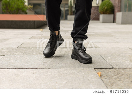 Elegant womens shoes on the foot on the street. Comfort and fashion Elegant womens shoes on the foot on the street. Comfort and fashion 95712056