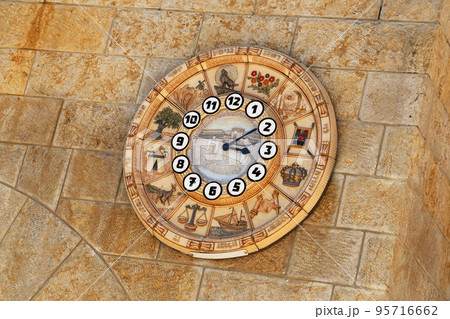 Old clock face shows time signs zodiac on western wall city Jerusalem Old clock face shows time signs zodiac on western wall city Jerusalem 95716662
