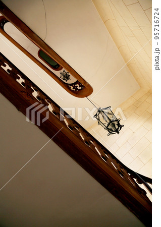View bottom up on beautiful luxury staircase with wooden railings 95716724