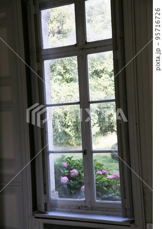Beautiful wooden frame window in old building without people Beautiful wooden frame window in old building without people 95716726