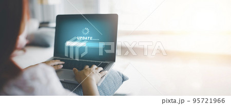 Woman using Laptop with Update Software Computer Program Upgrade Business Technology Internet, Update on virtual screen. Internet and technology concept, loading bar with installing the update. 95721966