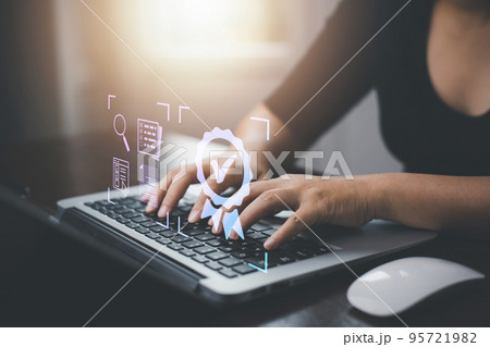 Quality assurance of business services, Businessman Hand shows the sign of the top service Quality assurance in Black background , Guarantee, Standards, ISO certification and standardization concept. 95721982