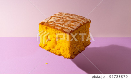 Pao de Lo - typical cake of Portugal on purple background Pao de Lo - typical cake of Portugal on purple background 95723379
