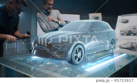 Engineers using tablet with holographic innovative application 95723917