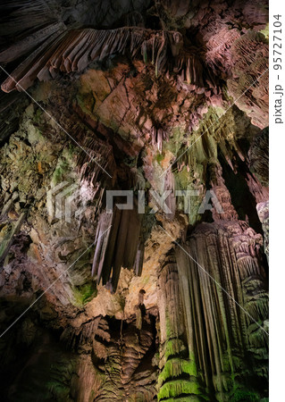 Saint Michael's Cave with colorful lights. Natural Rock Formation Saint Michael's Cave with colorful lights. Natural Rock Formation 95727104