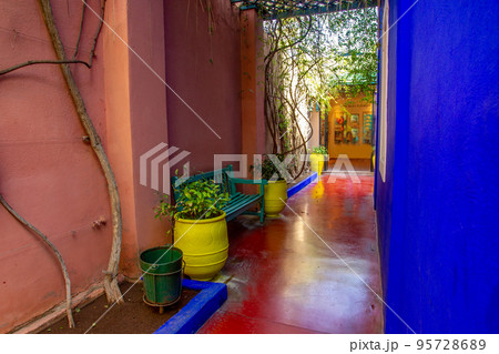 View on colorful potted plants in  former owner  of fashion guru Yves Saint Laurent of  Majorelle garden in Marracech 95728689