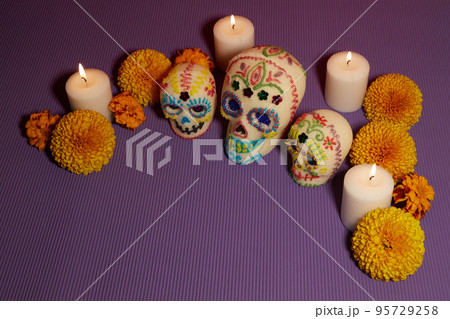 Dia de los muertos - Day of the dead Sugar skull with candles, and cempasuchil flowers altar decoration. Dia de los muertos - Day of the dead Sugar skull with candles, and cempasuchil flowers altar decoration. 95729258