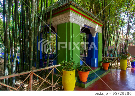 View on  blue-green gazebo (gardenhouse) l and bamboo forest in Majorelle garden in Marracech 95729286