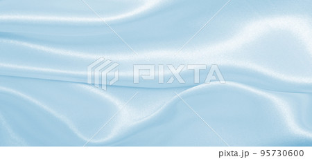 Smooth elegant blue silk or satin luxury cloth texture as abstract background. Luxurious background design Smooth elegant blue silk or satin luxury cloth texture as abstract background. Luxurious background design 95730600