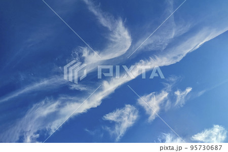 Cloudy summer sky landscape with light feathery clouds in the blue firmament. 95730687