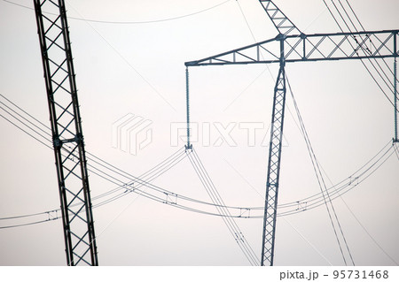 High voltage power line with insulation divider of electric power wires for safe delivering of electrical energy through steel cable on long distance High voltage power line with insulation divider of electric power wires for safe delivering of electrical energy through steel cable on long distance 95731468